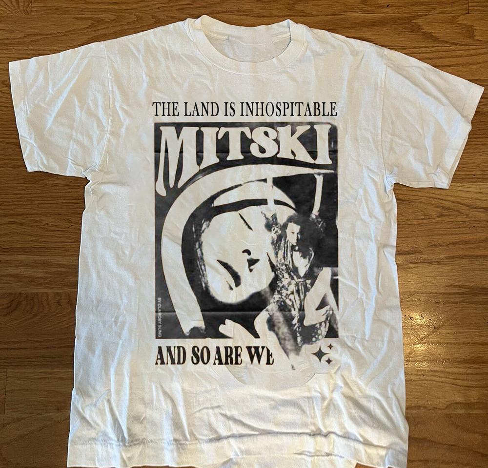 Mitski - THE LAND IS INHOSPITABLE Unisex T-Shirt All Size S To 5XL Unisex T-Shirt L
Mitski - THE LAND IS INHOSPITABLE Unisex T-Shirt All Size S To 5XL Unisex T-Shirt L