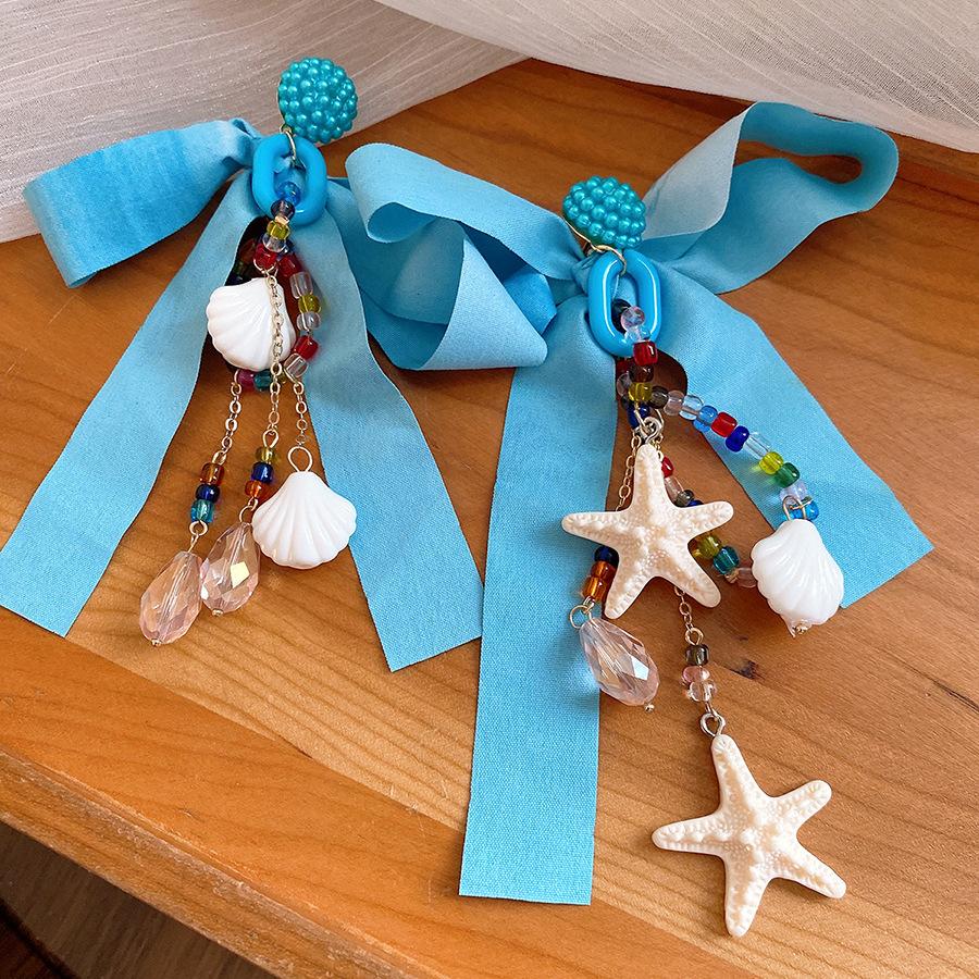 Silver needle chiffon bow shell pendant earrings niche fashion atmosphere earrings small fresh holiday style earrings
Silver needle chiffon bow shell pendant earrings niche fashion atmosphere earrings small fresh holiday style earrings