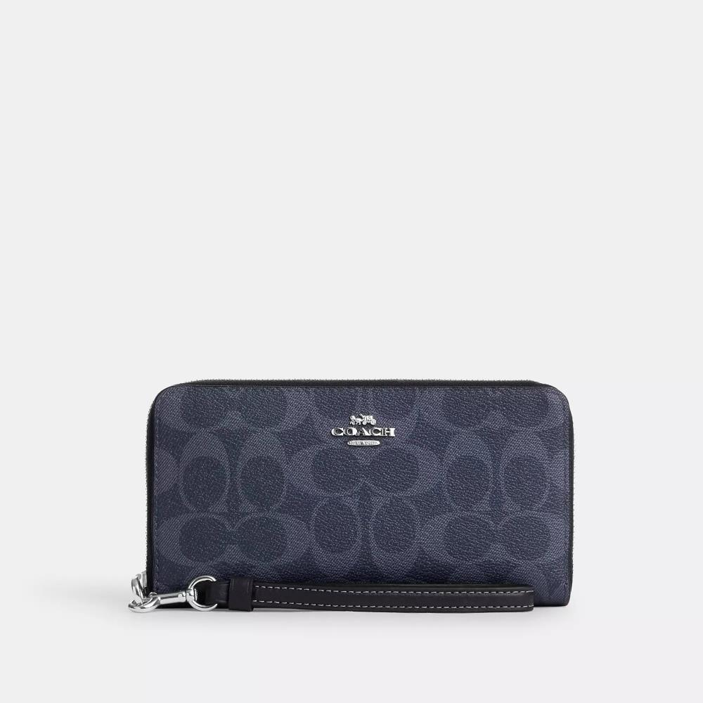 Coach Длинный кошелек на молнии из канвы Signature из серебристого денима темно-синего цвета
Coach Длинный кошелек на молнии из канвы Signature из серебристого денима темно-синего цвета