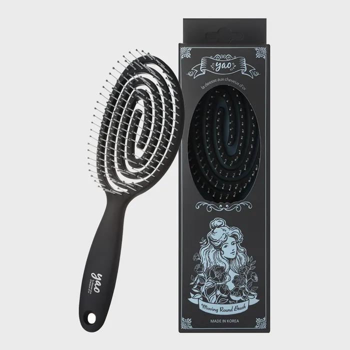 Темная круглая расческа для волос
Темная круглая расческа для волос