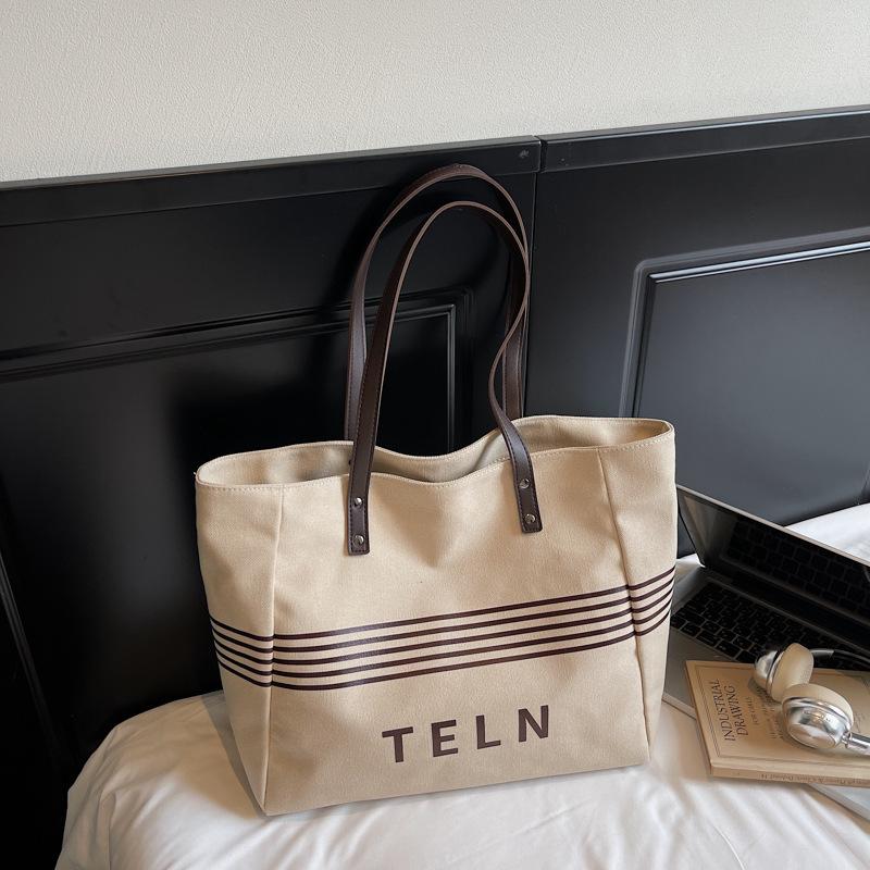 Корейская версия повседневной холщовой сумки большой вместимости 2025 осень новая модная простая полосатая сумка-тоут для поездок на работу, сумка через плечо хаки
Корейская версия повседневной холщовой сумки большой вместимости 2025 осень новая модная простая полосатая сумка-тоут для поездок на работу, сумка через плечо хаки