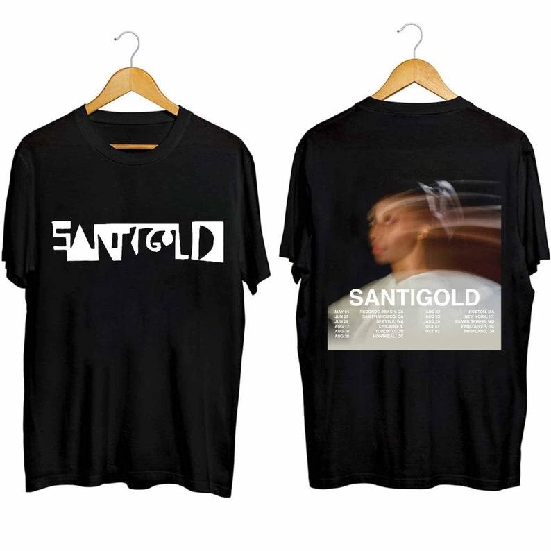Футболка из плотного хлопка 300GSM Santigold, рубашка для североамериканского тура, рубашка для фанатов Santigold, рубашка для концертов Santigold, футболка Santigold
Футболка из плотного хлопка 300GSM Santigold, рубашка для североамериканского тура, рубашка для фанатов Santigold, рубашка для концертов Santigold, футболка Santigold