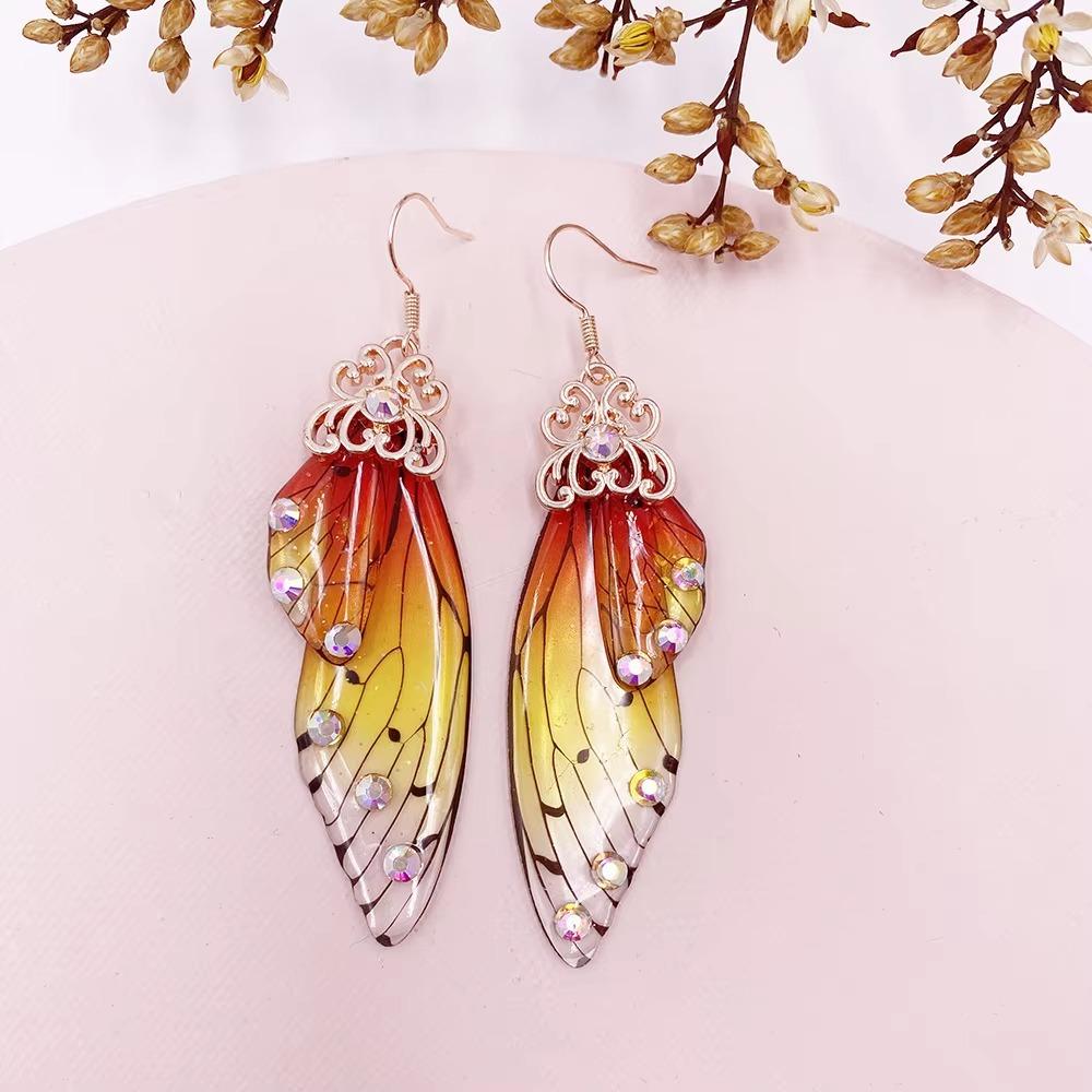 Colorful Gradient Color Cicada Wings Earring Romantic Simulation Wing Earring Cosplay Props червоний/жовтий
Colorful Gradient Color Cicada Wings Earring Romantic Simulation Wing Earring Cosplay Props червоний/жовтий