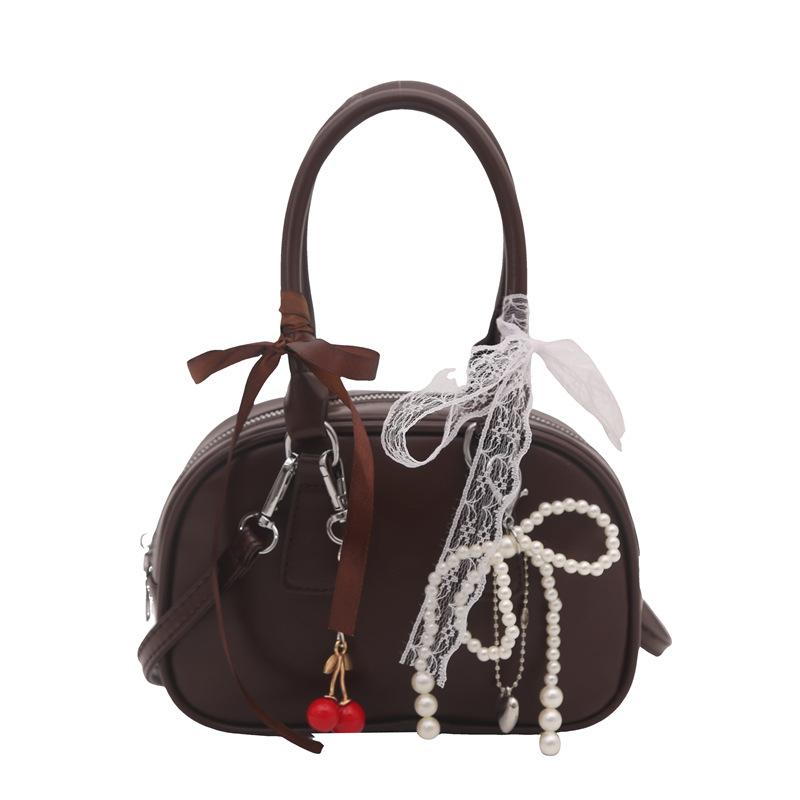 The new model is a niche portable pillow bag, a textured shoulder bag, a fashionable and simple bow messenger bag, and a female bag. кавовий
The new model is a niche portable pillow bag, a textured shoulder bag, a fashionable and simple bow messenger bag, and a female bag. кавовий