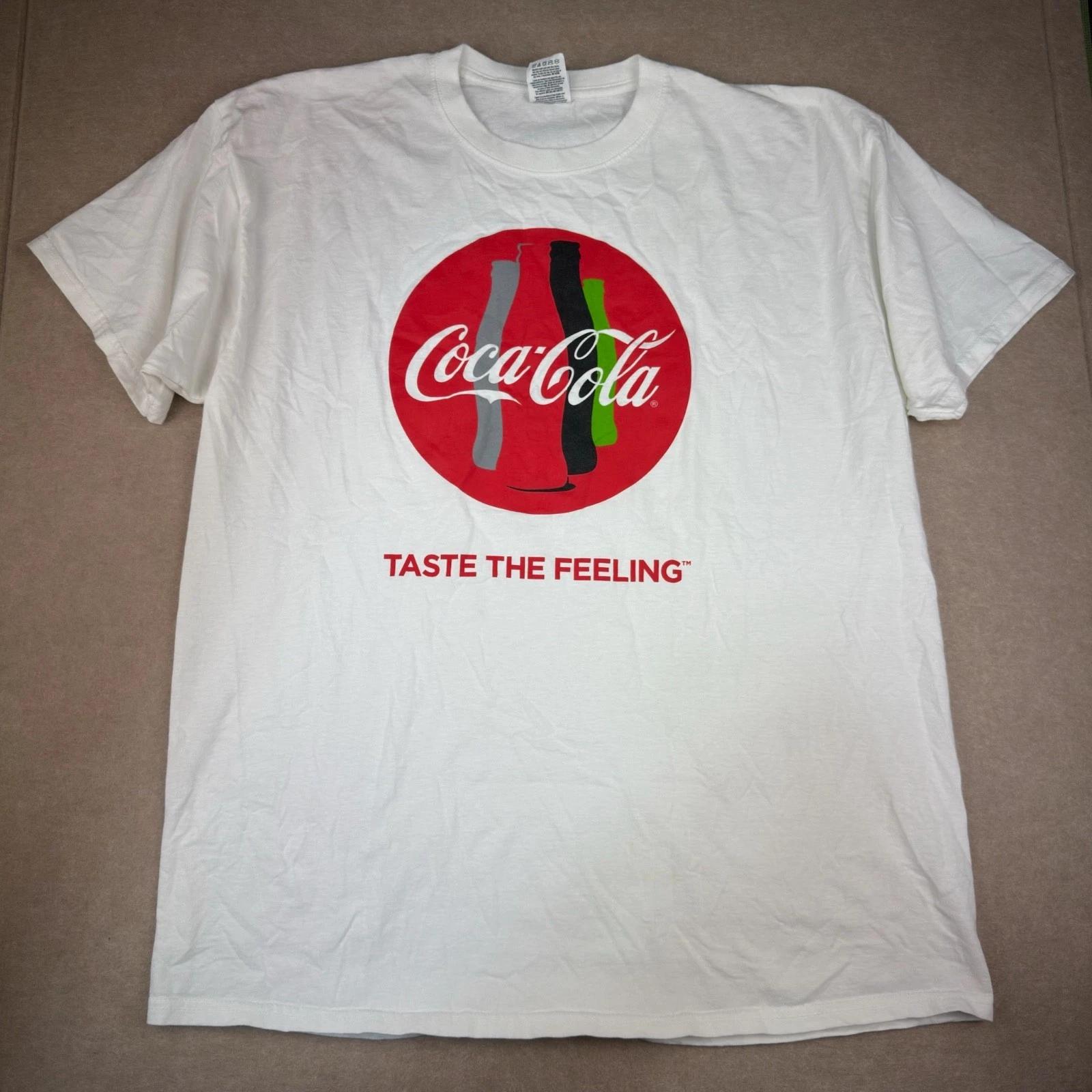 Coca-Cola Taste the Feeling Promo T-Shirt Men XL White Graphic Logo Soda Tee XL
Coca-Cola Taste the Feeling Promo T-Shirt Men XL White Graphic Logo Soda Tee XL