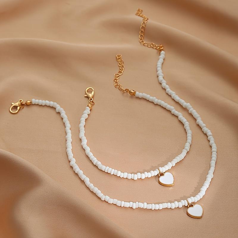 Стильный комплект из ожерелья и браслета с подвеской в виде сердца из бусин, идеально подходящий для подарка на свадьбу белый
Стильный комплект из ожерелья и браслета с подвеской в виде сердца из бусин, идеально подходящий для подарка на свадьбу белый