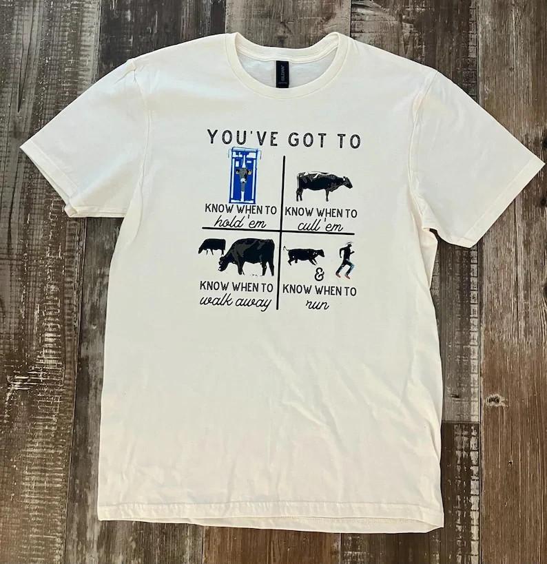 Funny Rancher Graphic Tee Know When to Hold 039Em Cow Shirt Full Size S3XL Unisex T-Shirt L
Funny Rancher Graphic Tee Know When to Hold 039Em Cow Shirt Full Size S3XL Unisex T-Shirt L