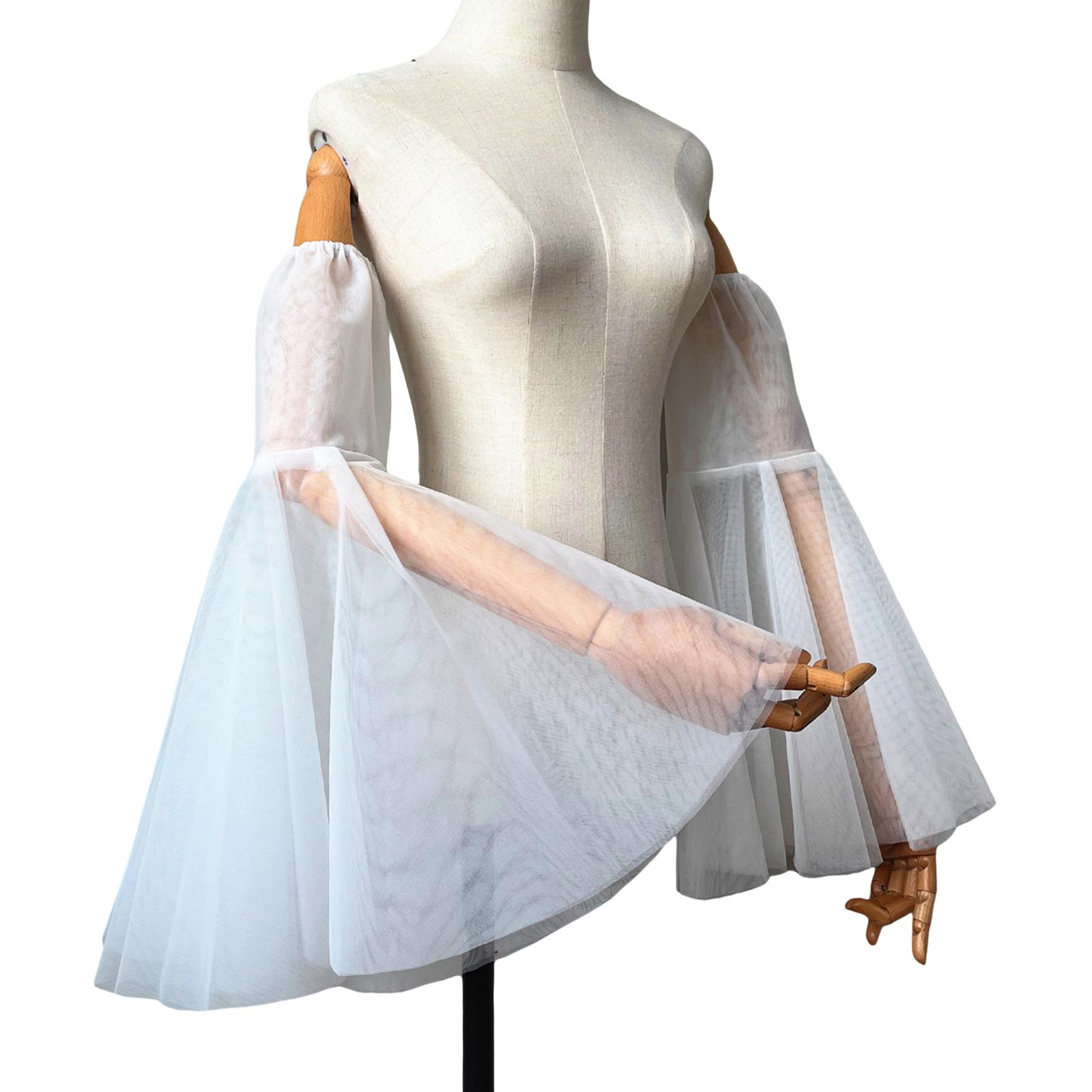 Элегантные прозрачные свадебные рукава для женщин с расклешенным дизайном, идеально подходящие для свадебного платья и формального мероприятия. 5
Элегантные прозрачные свадебные рукава для женщин с расклешенным дизайном, идеально подходящие для свадебного платья и формального мероприятия. 5