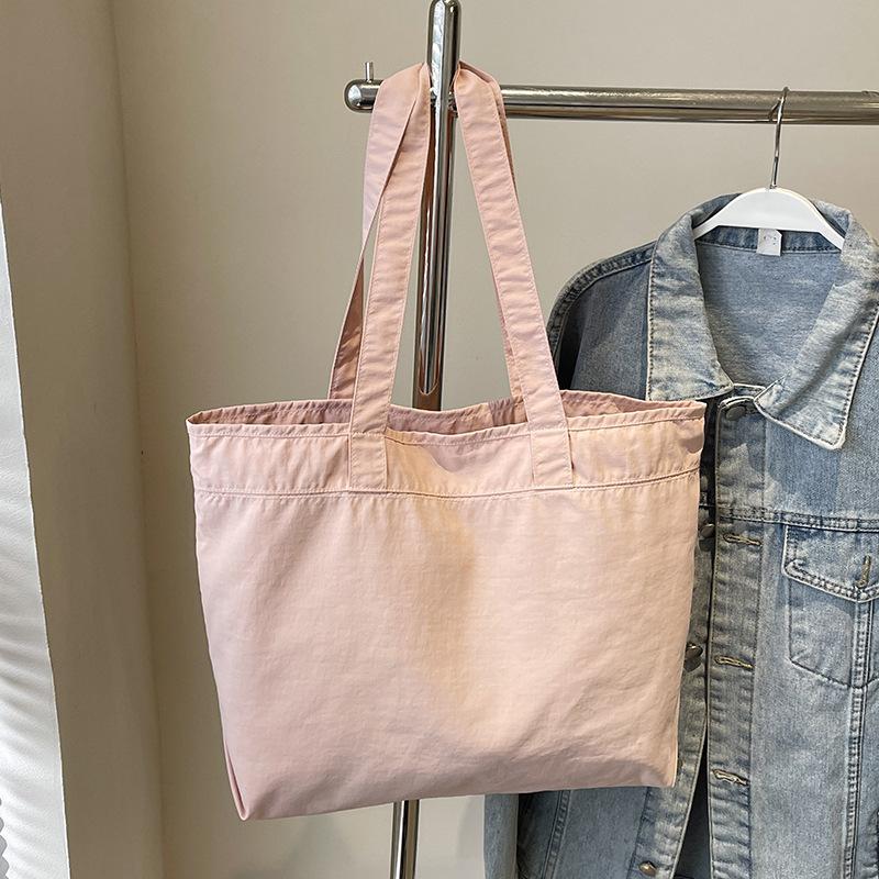 New nylon bag female student class shoulder bag large capacity portable large bag waterproof hand carry tote bag
New nylon bag female student class shoulder bag large capacity portable large bag waterproof hand carry tote bag