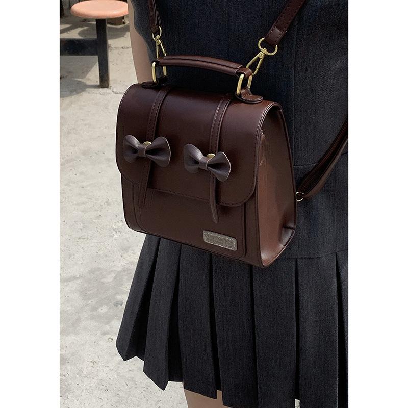 Retro College Backpack, Bow-shaped Backpack, Versatile Hand-held Student Schoolbag
Retro College Backpack, Bow-shaped Backpack, Versatile Hand-held Student Schoolbag