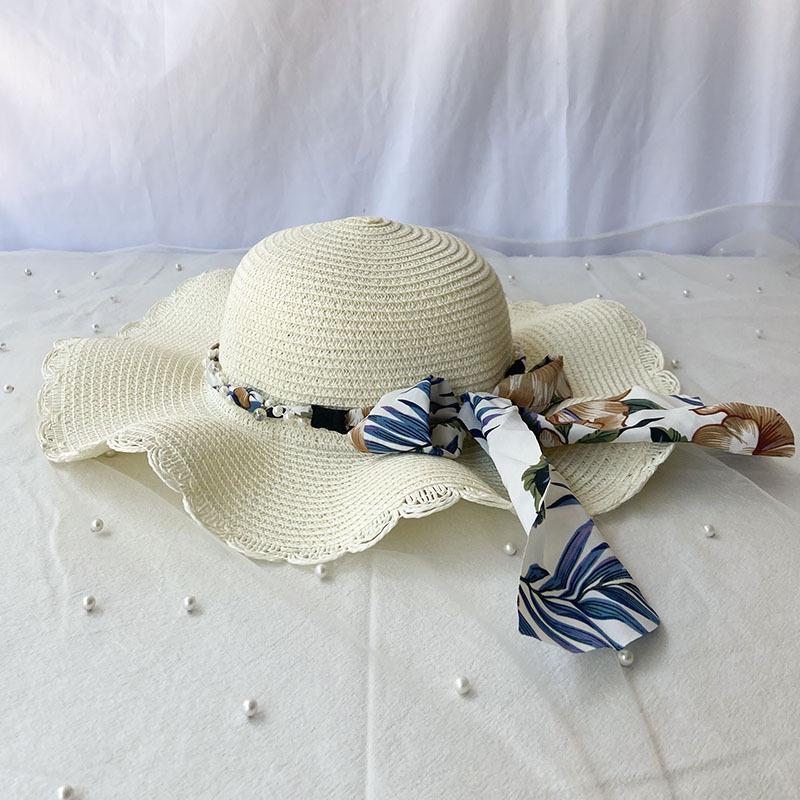 Шикарная летняя шляпа от солнца для женщин — соломенная пляжная кепка с широкими полями, бантом и цветочными акцентами, дышащая и с защитой от ультрафиолета one size молочный белый
