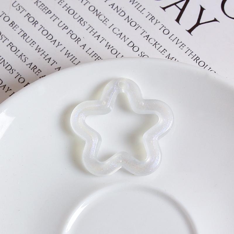 Luminous Iridescent Star Charms: Transparent Acrylic with Glitter Pentagram Design
Luminous Iridescent Star Charms: Transparent Acrylic with Glitter Pentagram Design