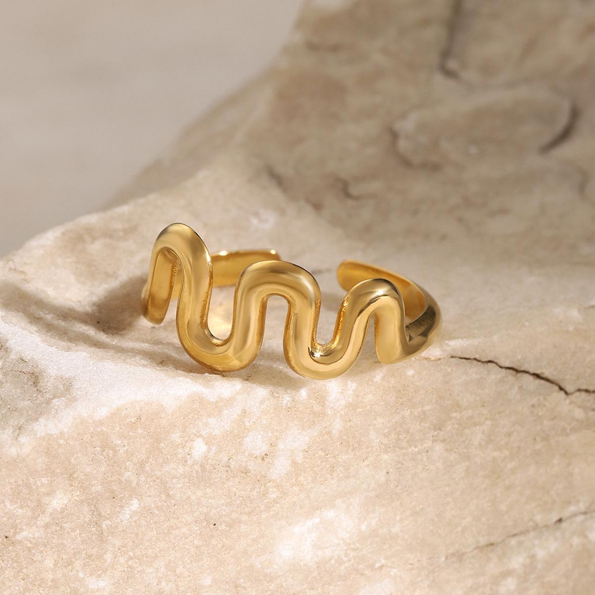 Women s 18k Gold Wave Pattern Stainless Steel Ring - European & American Style Titanium Steel.
Women s 18k Gold Wave Pattern Stainless Steel Ring - European & American Style Titanium Steel.