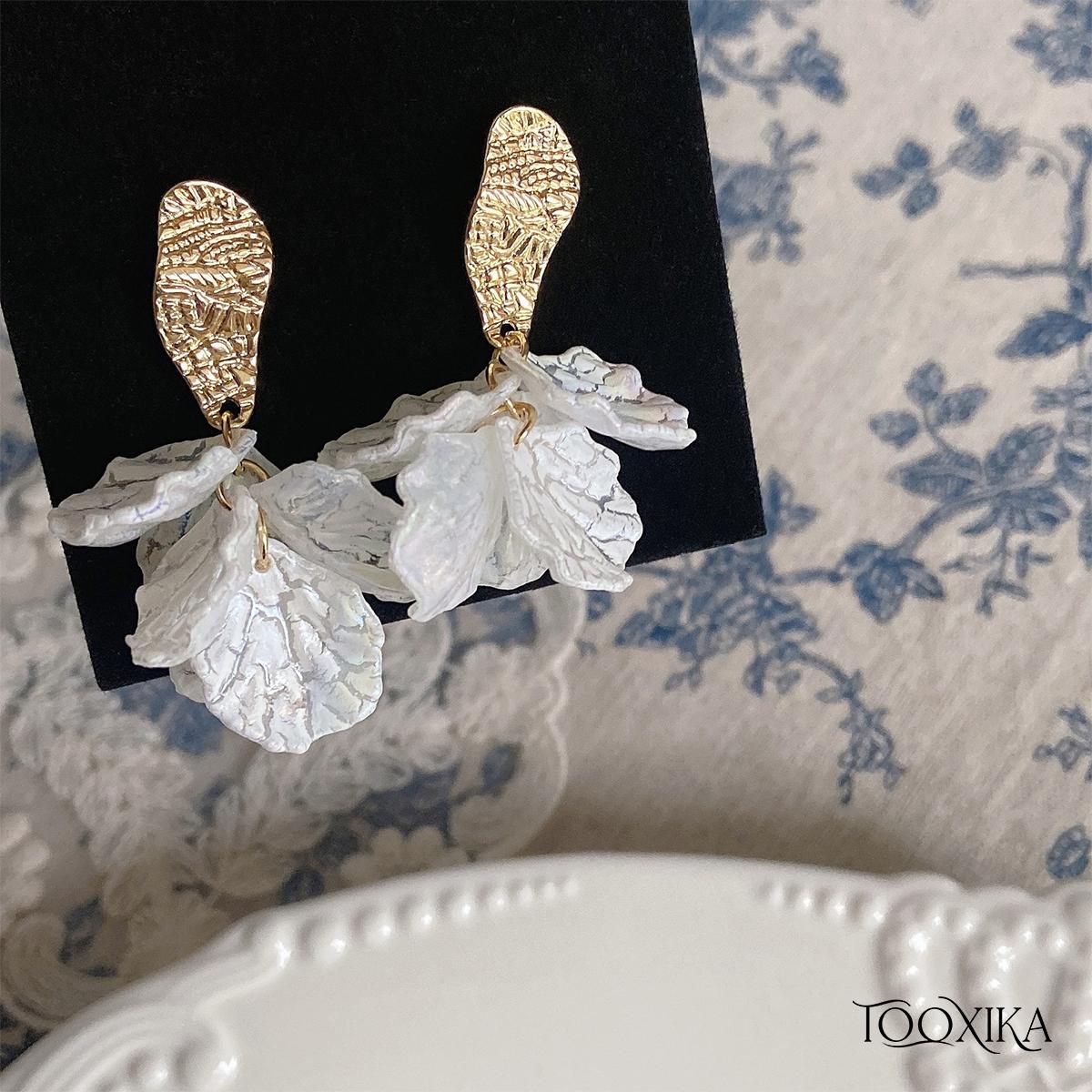Tooxika Beach Shell в гонконгском стиле, нежный темперамент, элитные супер фея, длинные белые серьги в форме ракушки с цветком, ретро зажим для ушей
Tooxika Beach Shell в гонконгском стиле, нежный темперамент, элитные супер фея, длинные белые серьги в форме ракушки с цветком, ретро зажим для ушей