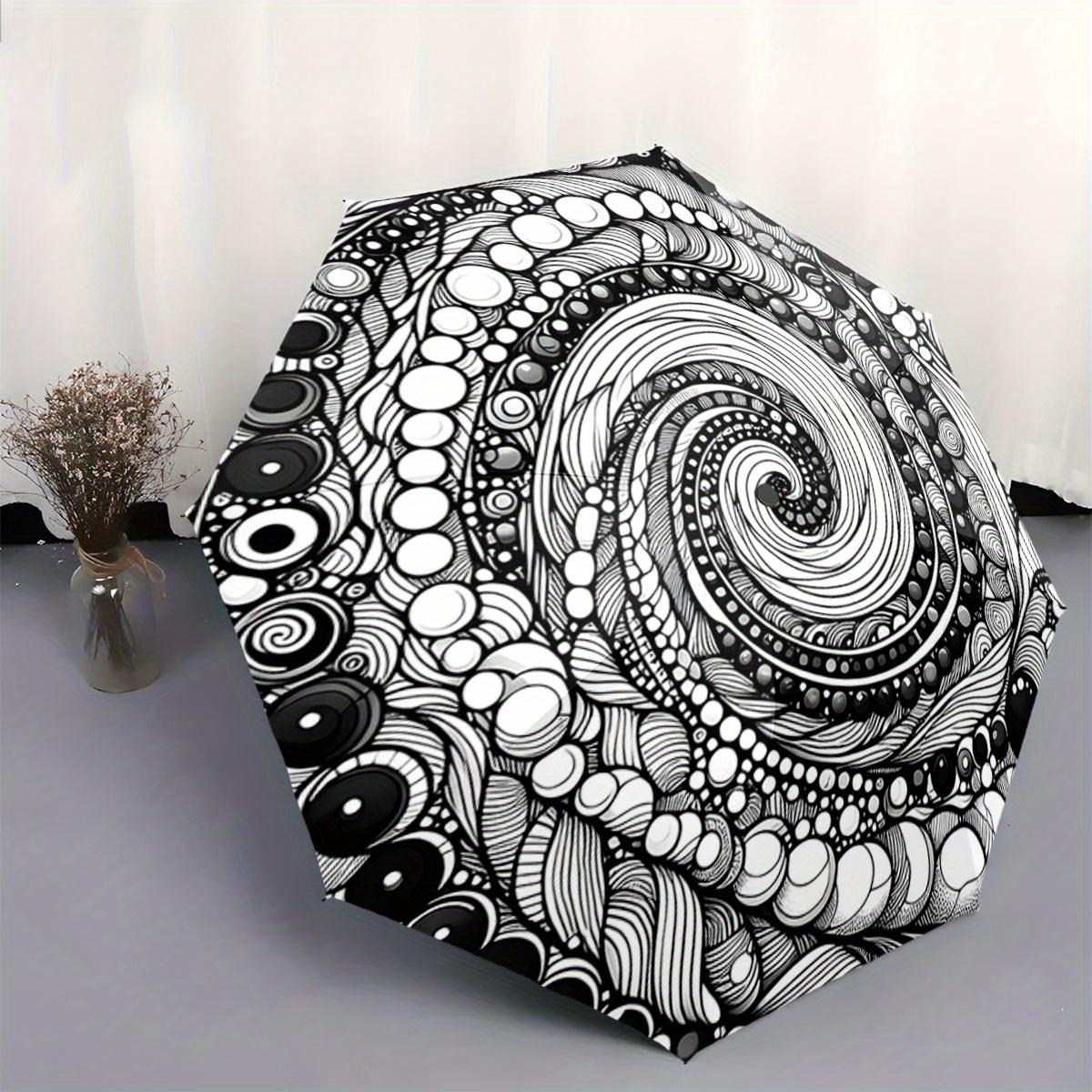 Automatic Folding Umbrella The umbrella features a black and white spiral pattern with circular accents. Portable collapsible
Automatic Folding Umbrella The umbrella features a black and white spiral pattern with circular accents. Portable collapsible