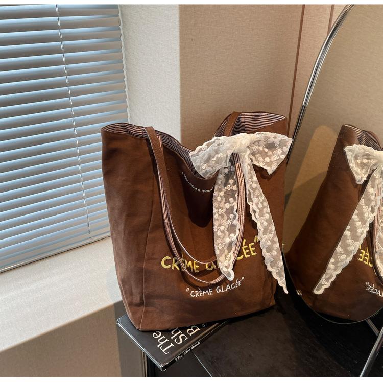 Large capacity canvas bag women s summer versatile new casual simple shoulder bag student tote bag темно-коричневого кольору
Large capacity canvas bag women s summer versatile new casual simple shoulder bag student tote bag темно-коричневого кольору