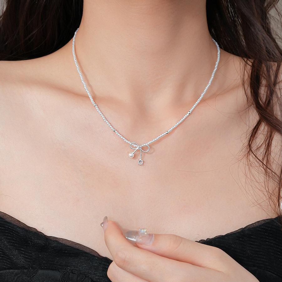Pearl zircon bow pendant necklace simple fashion small fresh collarbone chain versatile temperament high-end jewelry
Pearl zircon bow pendant necklace simple fashion small fresh collarbone chain versatile temperament high-end jewelry