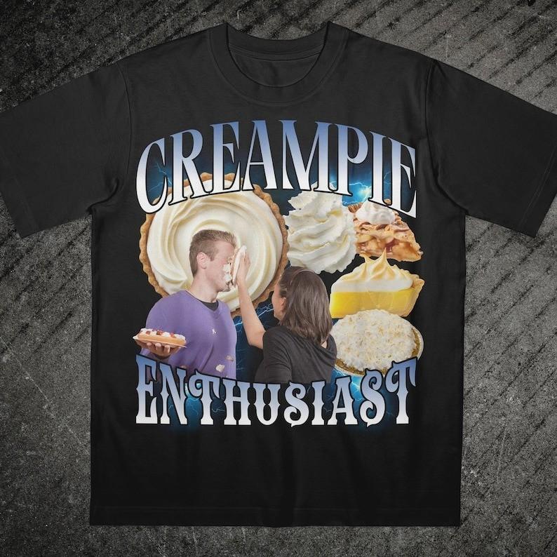 Funny Cream Pie Enthusiast TShirt Gen Z Dank Memes 90s Vintage Bootleg S3XL Unisex T-Shirt S
Funny Cream Pie Enthusiast TShirt Gen Z Dank Memes 90s Vintage Bootleg S3XL Unisex T-Shirt S