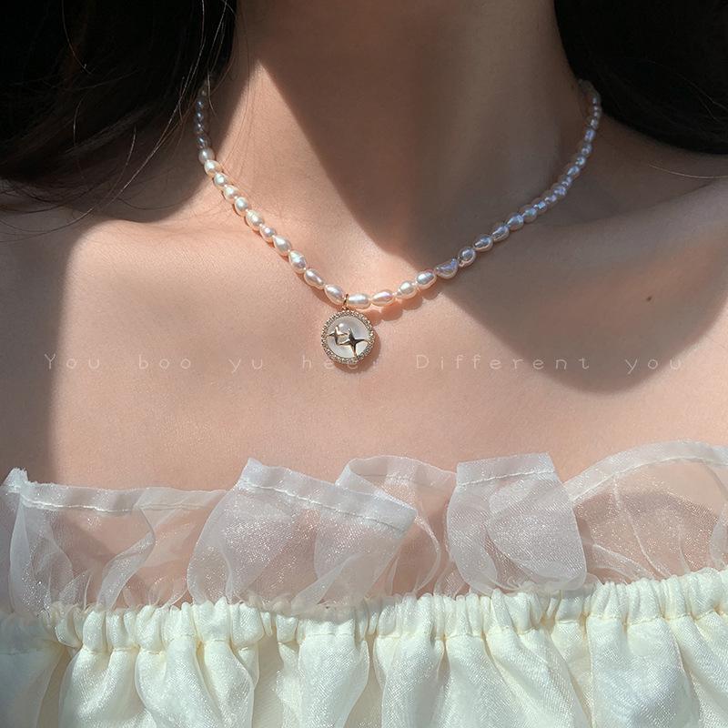 Retro Women s Choker: Freshwater Pearl & Cat s Eye Stone Necklace with Korean-Style Four-Pointed Star Design
Retro Women s Choker: Freshwater Pearl & Cat s Eye Stone Necklace with Korean-Style Four-Pointed Star Design