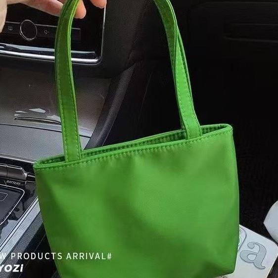 Nylon mini handbag tote women s bag is simple and portable when going out, and office workers carry small bags with new models.
Nylon mini handbag tote women s bag is simple and portable when going out, and office workers carry small bags with new models.