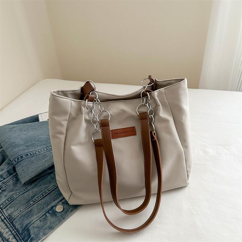 Літо 2024 новий тренд сумка через плече проста модна сумка великої місткості студентська сумка для жінок хакі
Літо 2024 новий тренд сумка через плече проста модна сумка великої місткості студентська сумка для жінок хакі