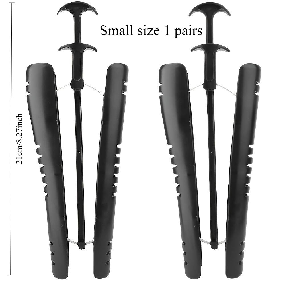 A pair of boot shapers/shoe trees, boot shape retainers, boot liner shapers with handles, tall boot shapers/boot clips.
A pair of boot shapers/shoe trees, boot shape retainers, boot liner shapers with handles, tall boot shapers/boot clips.
