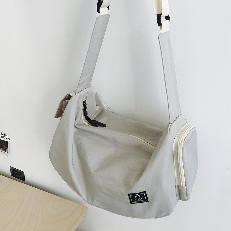 Легкая и повседневная сумка-тоут для хранения 2025 женская большая вместимость для активного отдыха нишевая мужская студенческая модная сумка через плечо серый
Легкая и повседневная сумка-тоут для хранения 2025 женская большая вместимость для активного отдыха нишевая мужская студенческая модная сумка через плечо серый