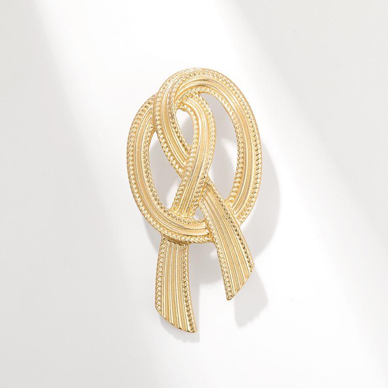 Элегантная винтажная золотая брошь-бант-узел для пальто и костюмов
Элегантная винтажная золотая брошь-бант-узел для пальто и костюмов