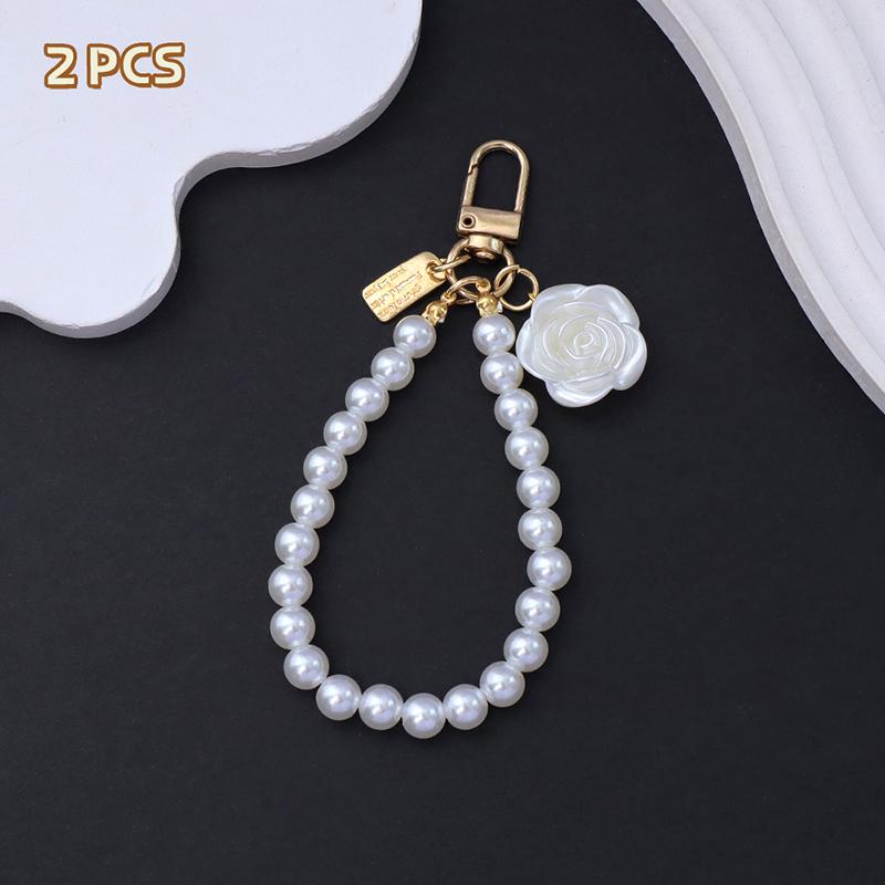 2 шт. Брелок с подвеской в виде цветка розы и банта, цепочка из жемчуга, браслет на запястье для женщин, короткий ремешок на запястье для мобильного телефона
2 шт. Брелок с подвеской в виде цветка розы и банта, цепочка из жемчуга, браслет на запястье для женщин, короткий ремешок на запястье для мобильного телефона