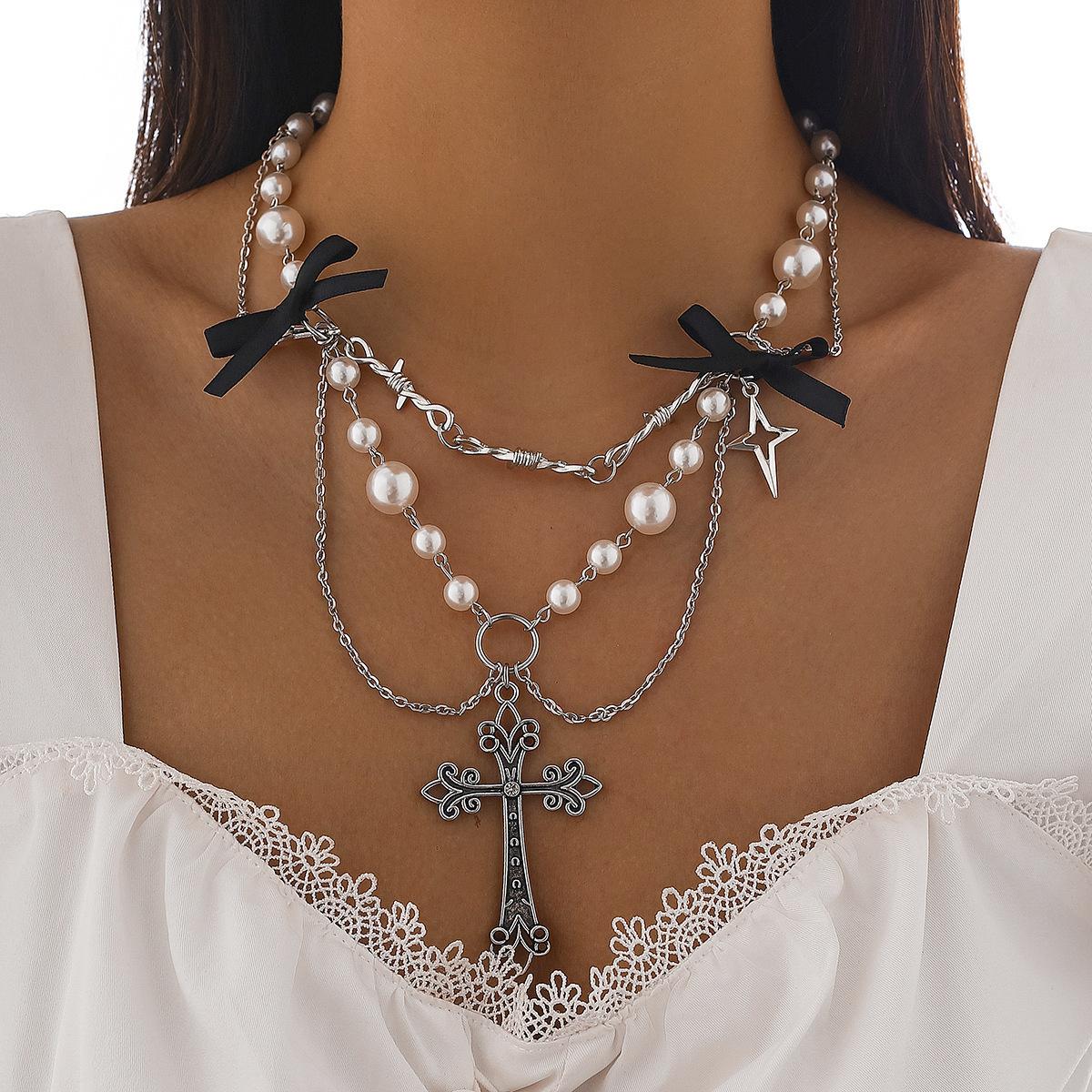 Sweet and cool ins style bow item jewelry, punk metal cross imitation pearl fringed necklace.
Sweet and cool ins style bow item jewelry, punk metal cross imitation pearl fringed necklace.