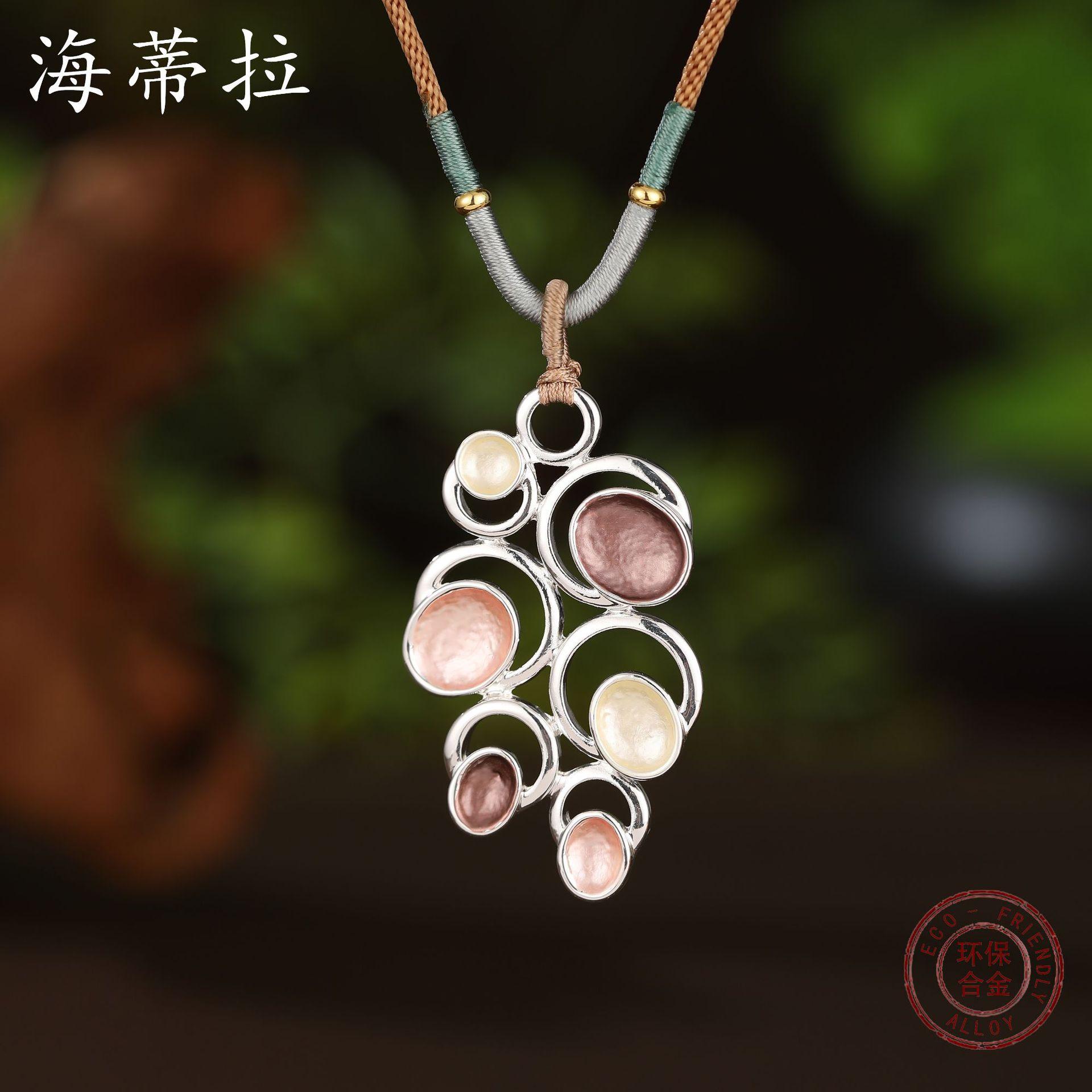 New color painting oil hollow round flower woven rope long pendant, women s retro versatile long necklace
New color painting oil hollow round flower woven rope long pendant, women s retro versatile long necklace
