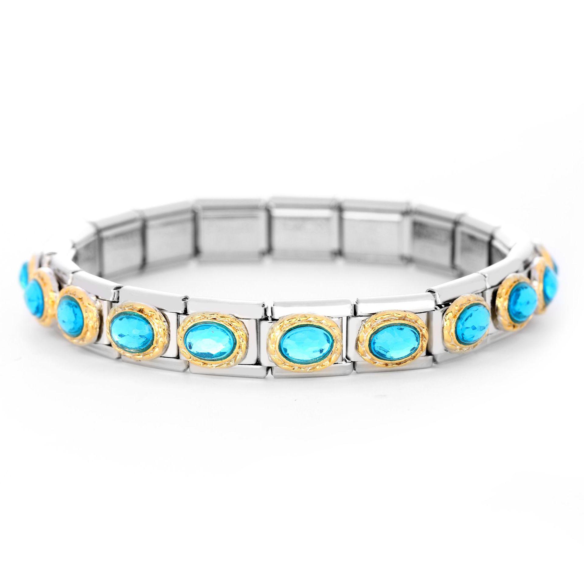 Gold-Edged Stainless Steel Bracelet with Oval Champagne Blue Gemstones
Gold-Edged Stainless Steel Bracelet with Oval Champagne Blue Gemstones