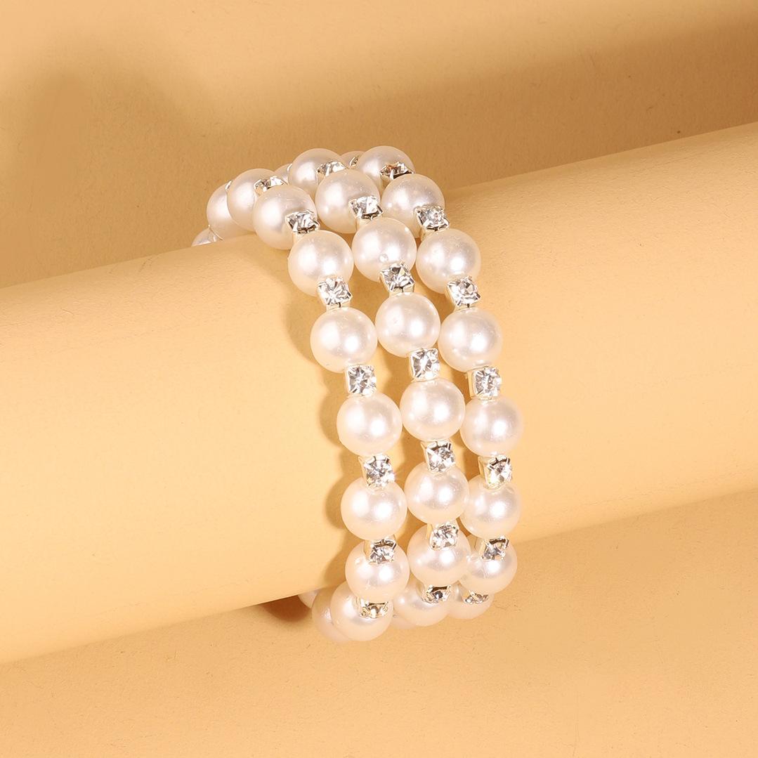 Классический жемчужный браслет с тремя петлями, многослойный эластичный браслет с жемчугом и стразами серебряный
Классический жемчужный браслет с тремя петлями, многослойный эластичный браслет с жемчугом и стразами серебряный