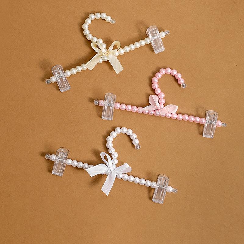 5 шт., с искусственным жемчугом и лентой, бантом, 24,5/32 см, вешалка для брюк с жемчугом, элегантная вешалка для брюк с искусственным жемчугом 
5 шт., с искусственным жемчугом и лентой, бантом, 24,5/32 см, вешалка для брюк с жемчугом, элегантная вешалка для брюк с искусственным жемчугом