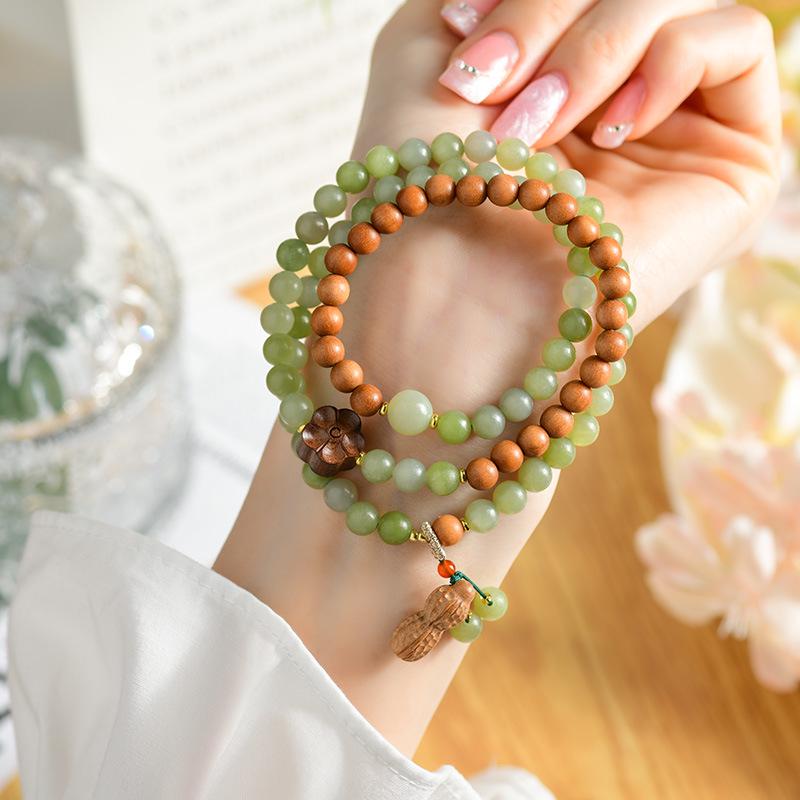 Natural Jade Sandalwood Triple-Circle Bracelet with Flower and Peanut Pendants - Ancient-Style Cultural Design
Natural Jade Sandalwood Triple-Circle Bracelet with Flower and Peanut Pendants - Ancient-Style Cultural Design
