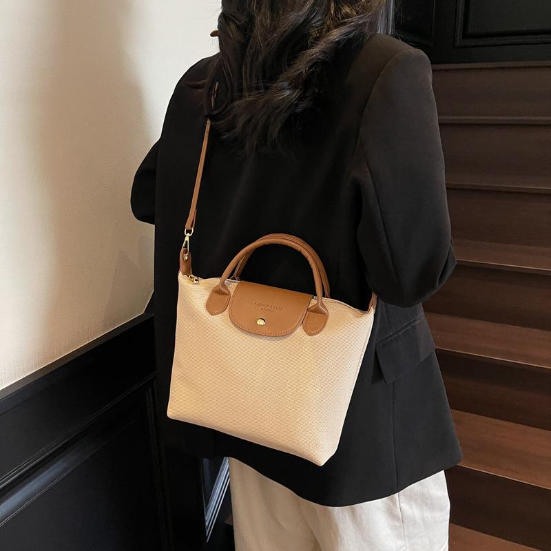 Canvas bag women 2025 niche design portable shoulder bag small dumpling bag messenger bag
Canvas bag women 2025 niche design portable shoulder bag small dumpling bag messenger bag