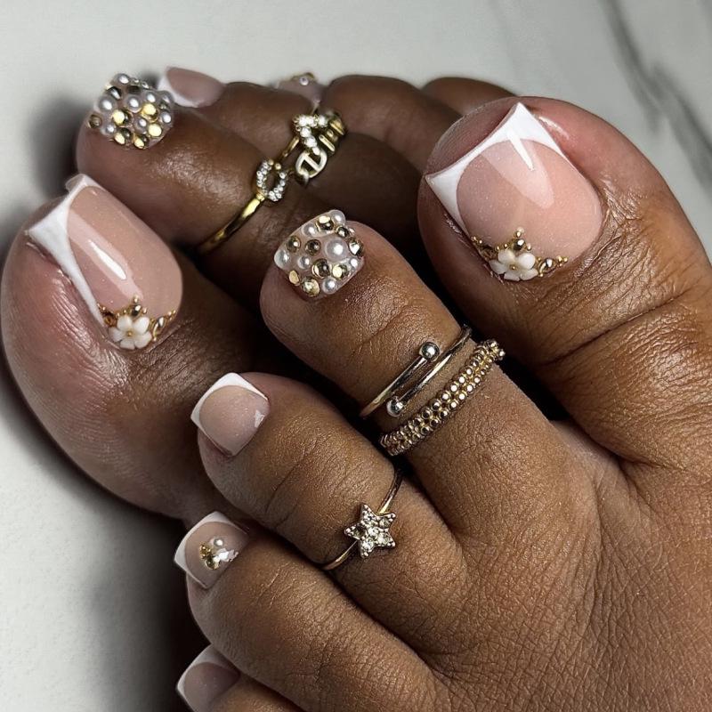 Sparkly Pearl Rhinestone French White Toenail Tips
Sparkly Pearl Rhinestone French White Toenail Tips