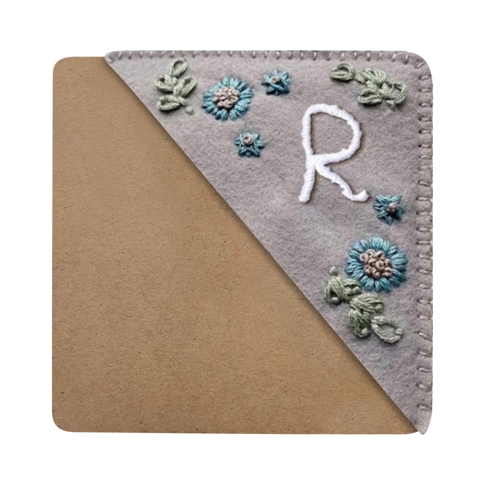 Handmade Embroidered Fabric Bookmark with Floral Pattern and Letter Design Soft Felt Material Durable Stitching for Book Lovers
Handmade Embroidered Fabric Bookmark with Floral Pattern and Letter Design Soft Felt Material Durable Stitching for Book Lovers