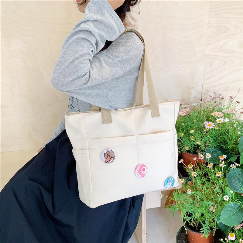 Original design zipper thickened canvas tote bag casual art student simple shoulder handbag one size fits all
Original design zipper thickened canvas tote bag casual art student simple shoulder handbag one size fits all