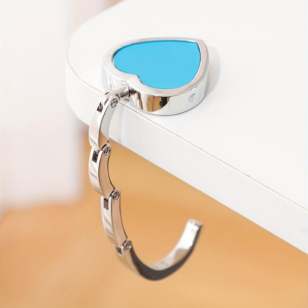 Bag Hanger Heart Shaped Handbag Hanger Metal Folding Bag Holder Space Saving Portable Purse Hook For Desk небо синє кольору
Bag Hanger Heart Shaped Handbag Hanger Metal Folding Bag Holder Space Saving Portable Purse Hook For Desk небо синє кольору