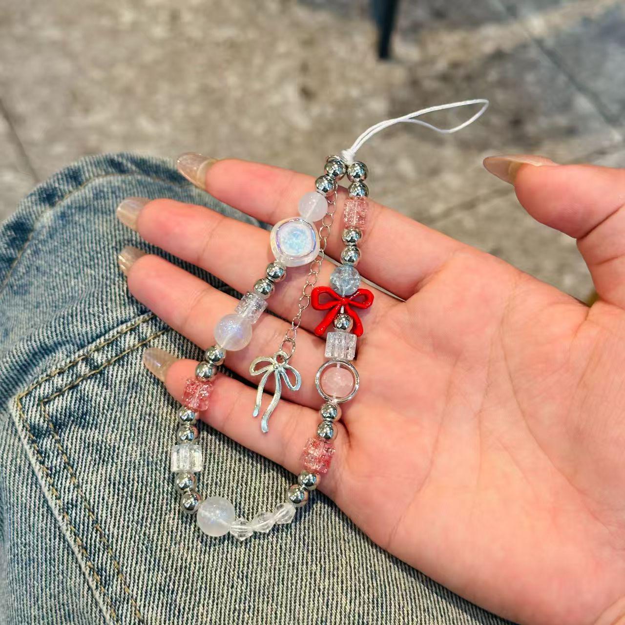 Red Bow Phone Lanyard with Keychain and Bag Charm
Red Bow Phone Lanyard with Keychain and Bag Charm