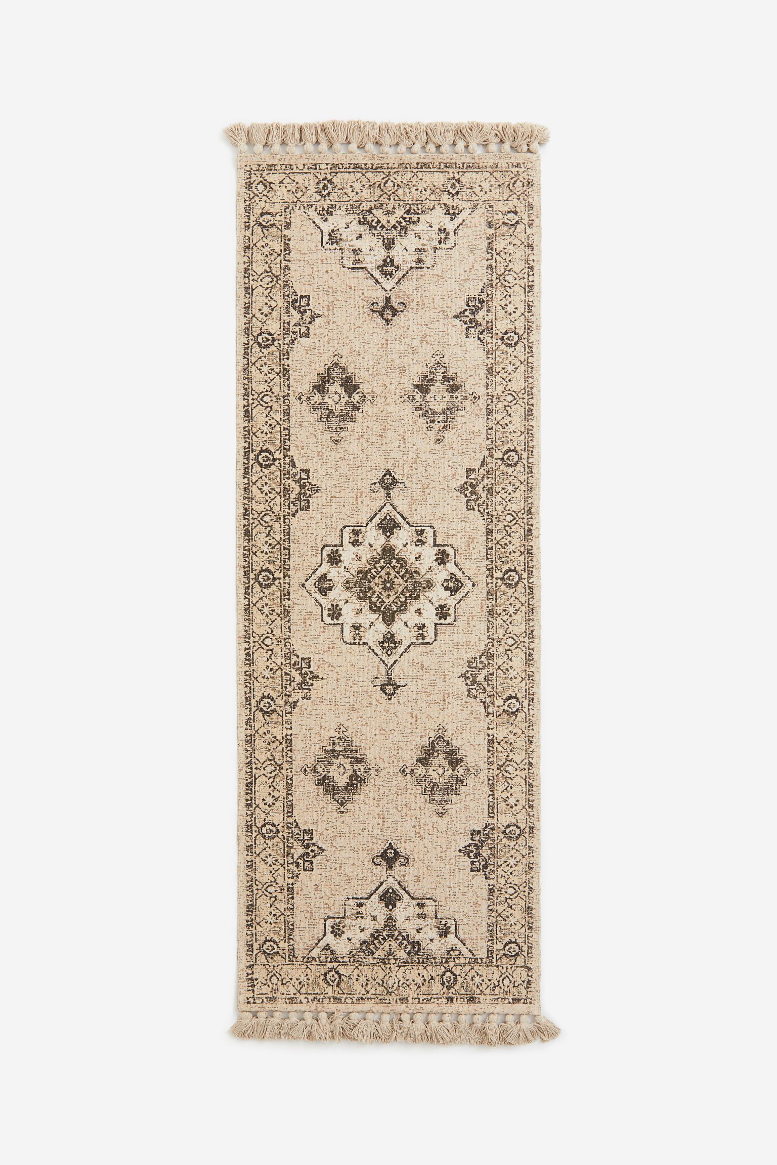 Fringed patterned rug 
Fringed patterned rug
