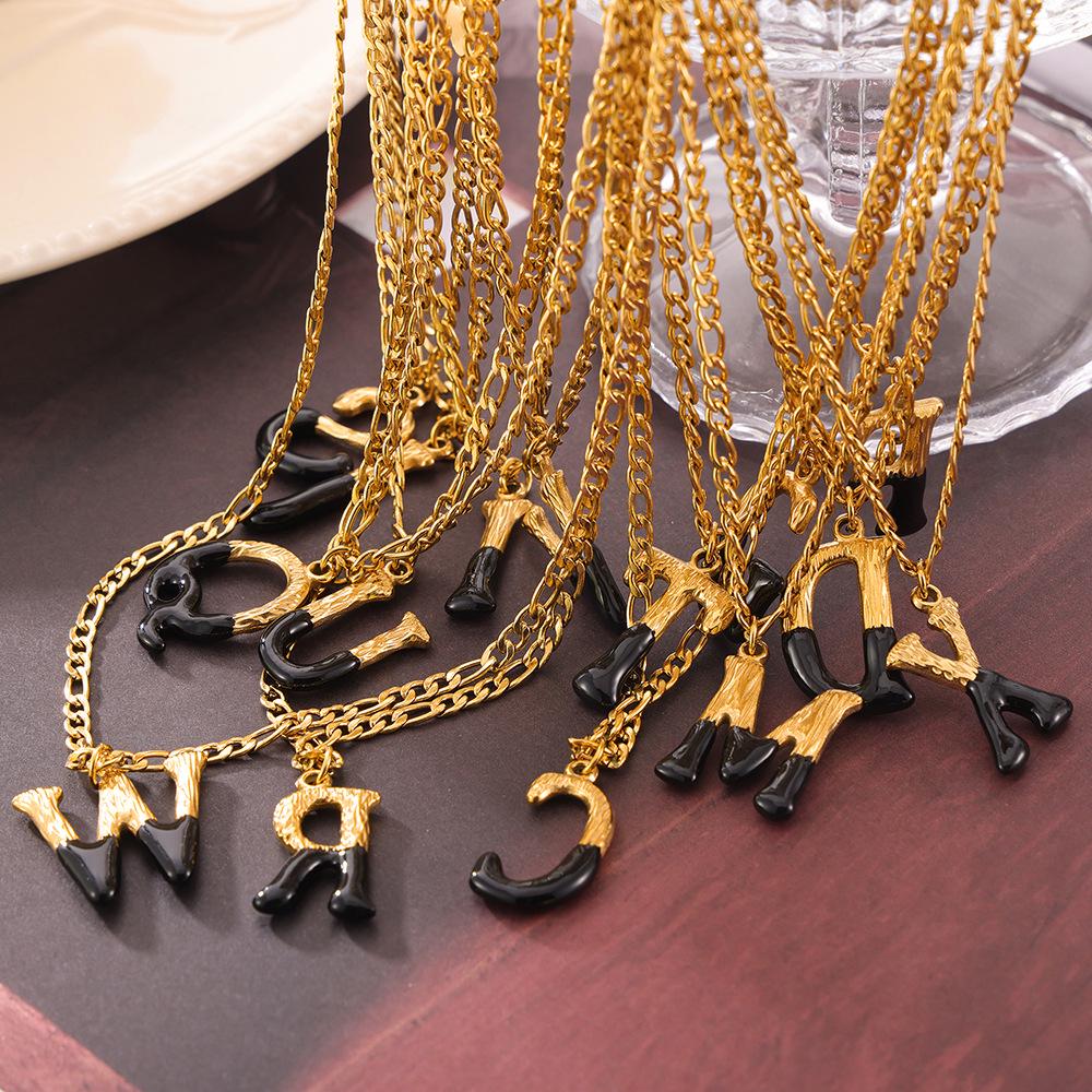 Minimalist Light Luxury Titanium Steel Initial Necklace, Non-Fading with Black Drip Oil.
Minimalist Light Luxury Titanium Steel Initial Necklace, Non-Fading with Black Drip Oil.