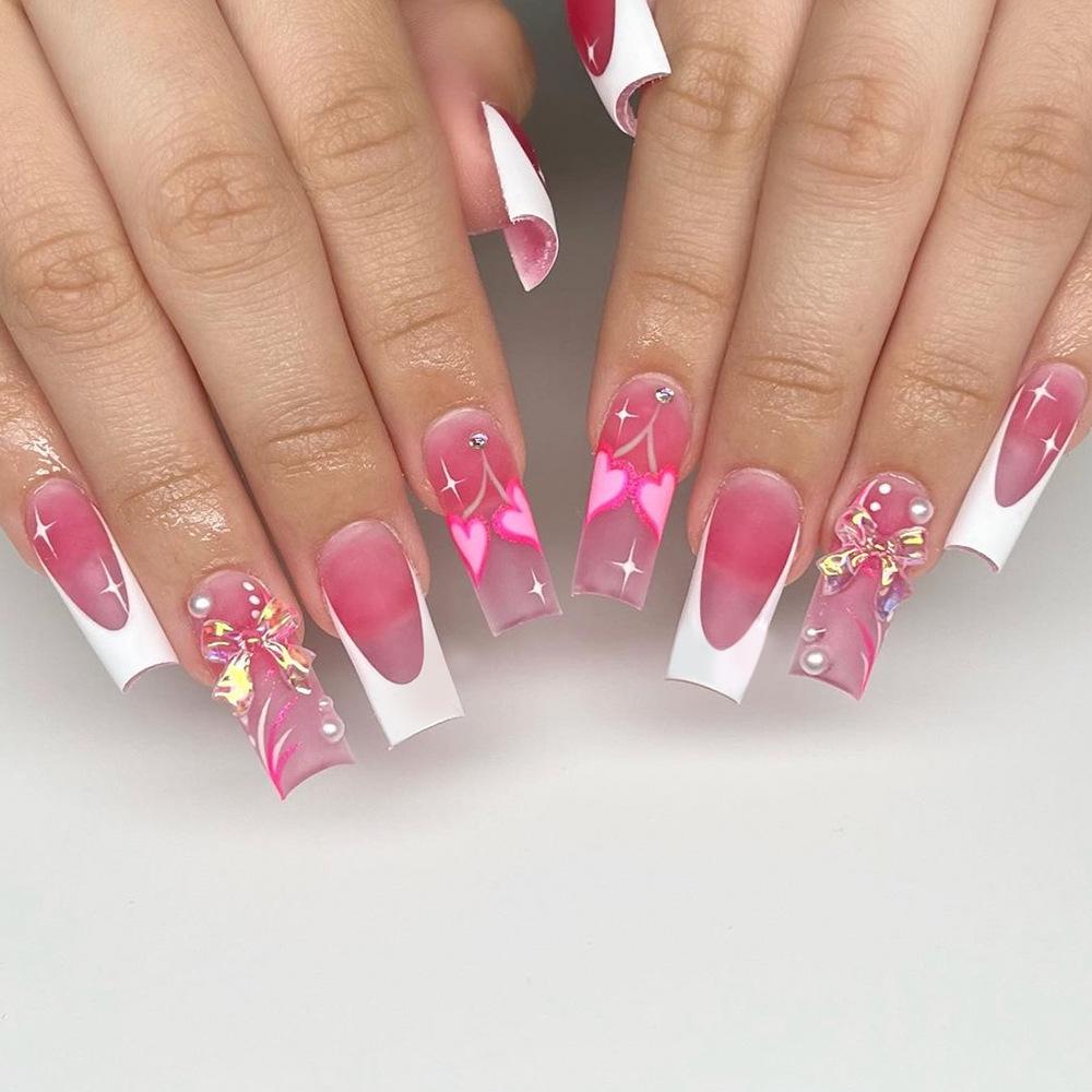 Pink Long Coffin Press-on Nails with 3D Aurora Bow, Pearl Rhinestones, and White French Tips
Pink Long Coffin Press-on Nails with 3D Aurora Bow, Pearl Rhinestones, and White French Tips