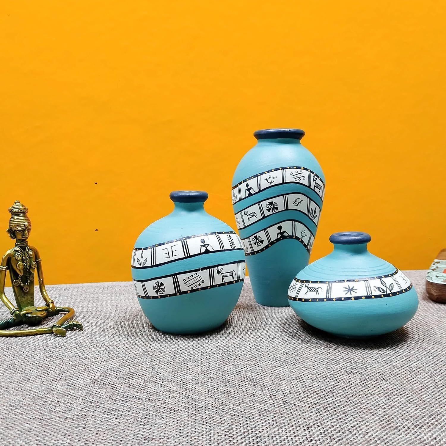 Warli Turquoise Blue Handpainted Oblong Flower Vase, Terracotta Decorative For Home Decor Earthen Flower Vases Pots For Home & Office (Set Of 3)
Warli Turquoise Blue Handpainted Oblong Flower Vase, Terracotta Decorative For Home Decor Earthen Flower Vases Pots For Home & Office (Set Of 3)