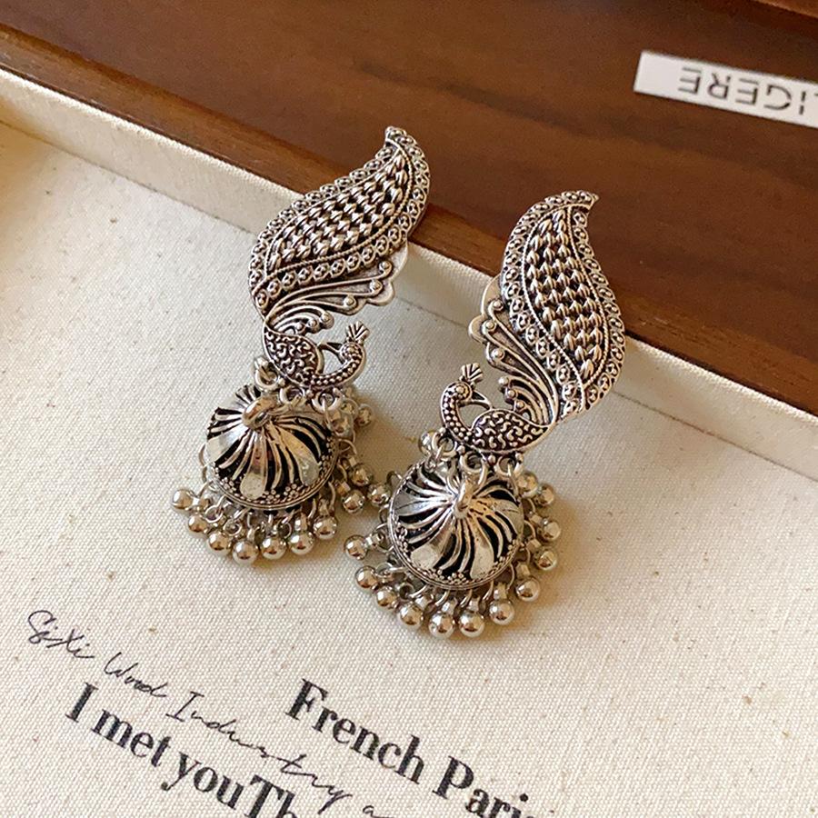 Silver needle oil dripping peacock bell fringed earrings vintage medieval fashion earrings light luxury high-end earrings women
Silver needle oil dripping peacock bell fringed earrings vintage medieval fashion earrings light luxury high-end earrings women