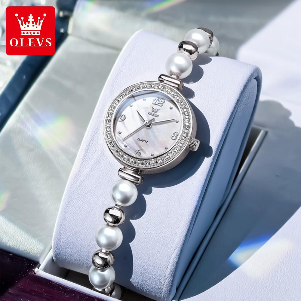 OLEVS Woman Watch Fashion Elegant Pearl Bracelet Wristwatch for Women Luxury Diamond Bezel Waterproof Ladies Quartz Watches 5640 срібні білого кольору
OLEVS Woman Watch Fashion Elegant Pearl Bracelet Wristwatch for Women Luxury Diamond Bezel Waterproof Ladies Quartz Watches 5640 срібні білого кольору