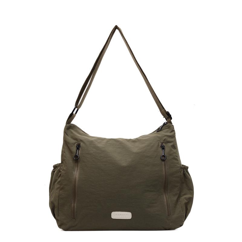 Сумка великої місткості. Жіноча сумка через плече. Сумка через плече темно-зелений колір
Сумка великої місткості. Жіноча сумка через плече. Сумка через плече темно-зелений колір