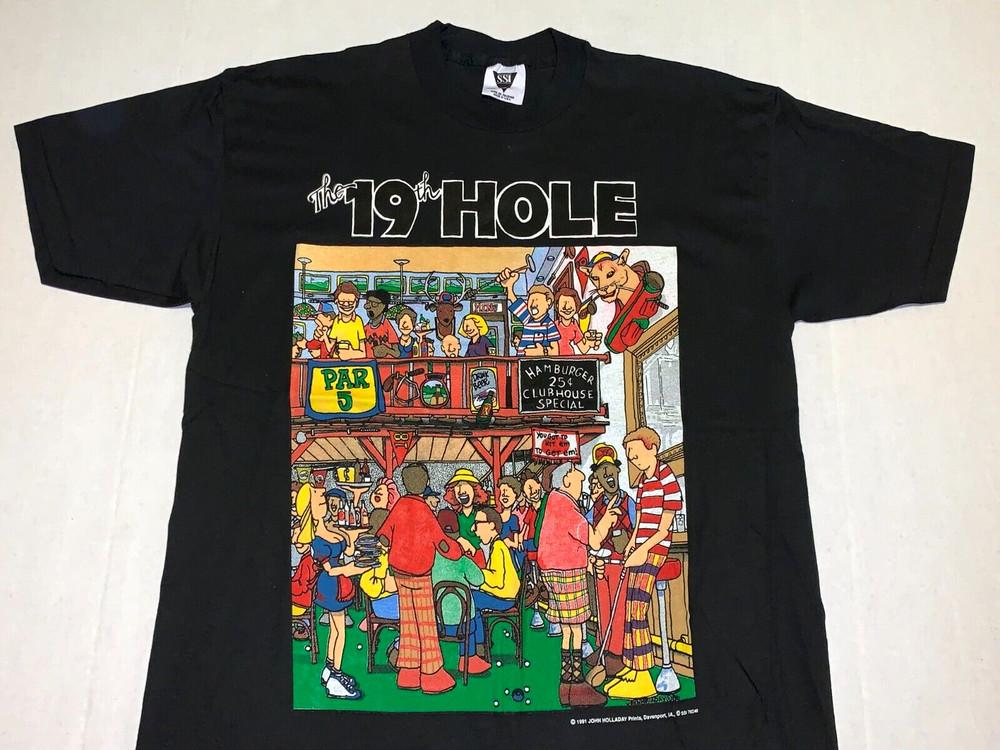 Rare! Vintage 1991 The 19th Hole John Holladay Prints Golf T-Shirt New! LARGE Unisex T-Shirt XXXXL
Rare! Vintage 1991 The 19th Hole John Holladay Prints Golf T-Shirt New! LARGE Unisex T-Shirt XXXXL