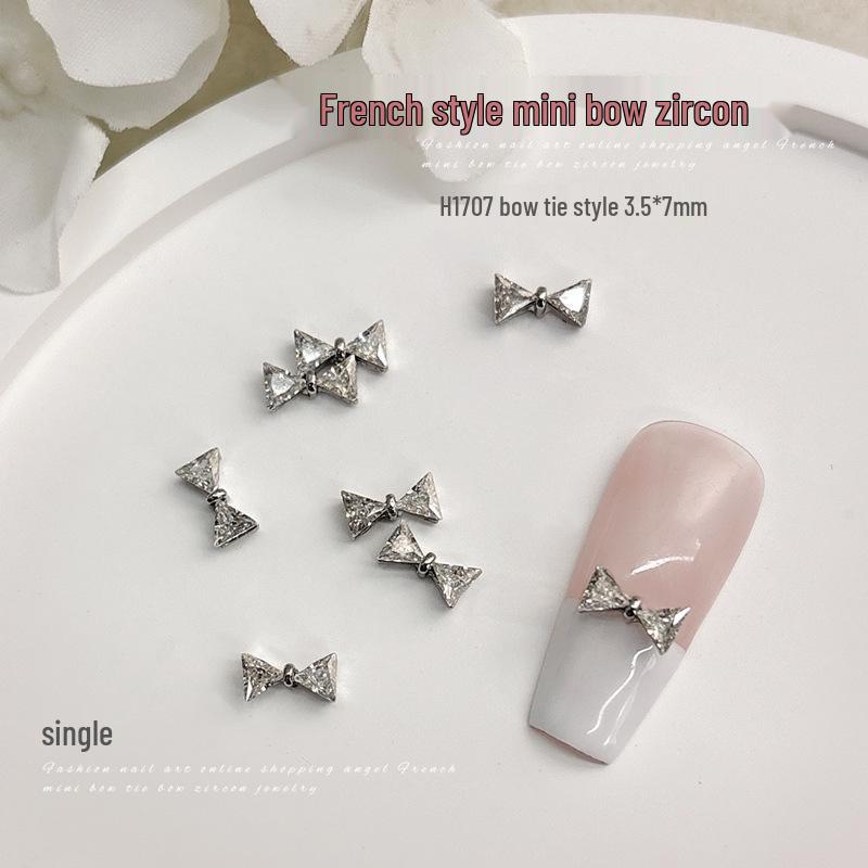 Французькі міні циркон бантики стрази для нейл-арту - 3D блискучий сріблястий метелик, трендовий стиль
Французькі міні циркон бантики стрази для нейл-арту - 3D блискучий сріблястий метелик, трендовий стиль